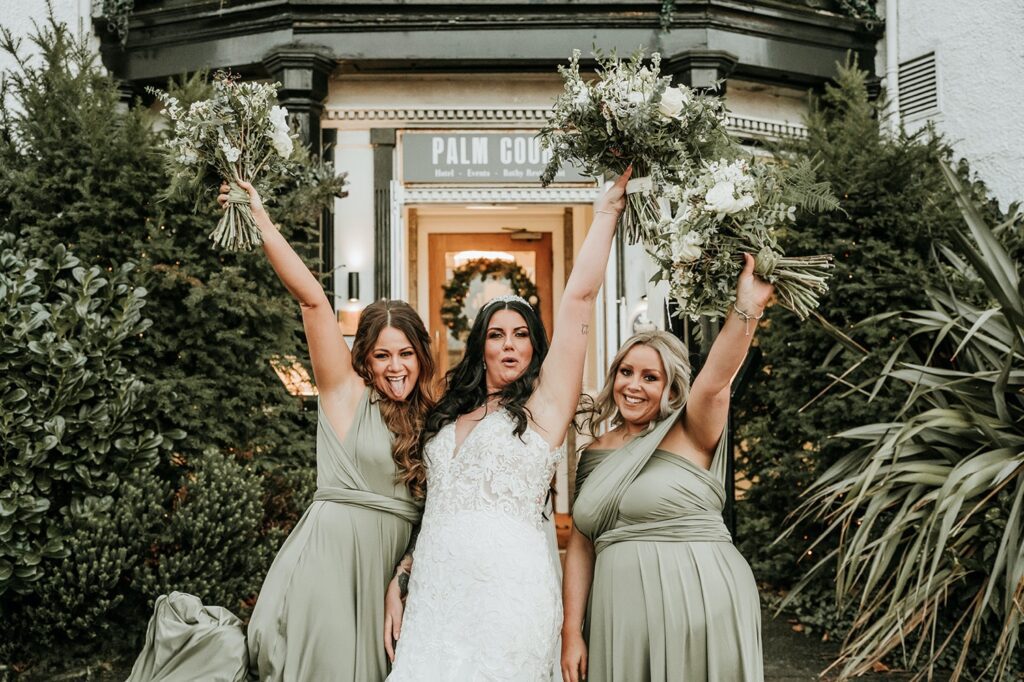 Bride and Bridesmaids in green dresses posing for group shots on wedding day