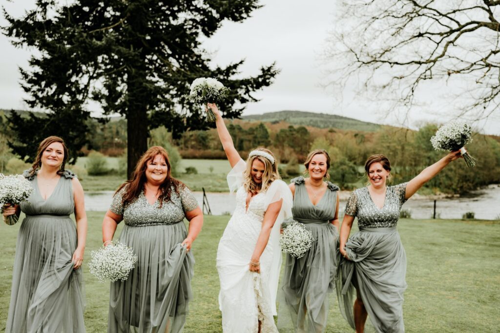 Bride with her bridesmaids wearing green dresses at Banchory Lodge Hotel