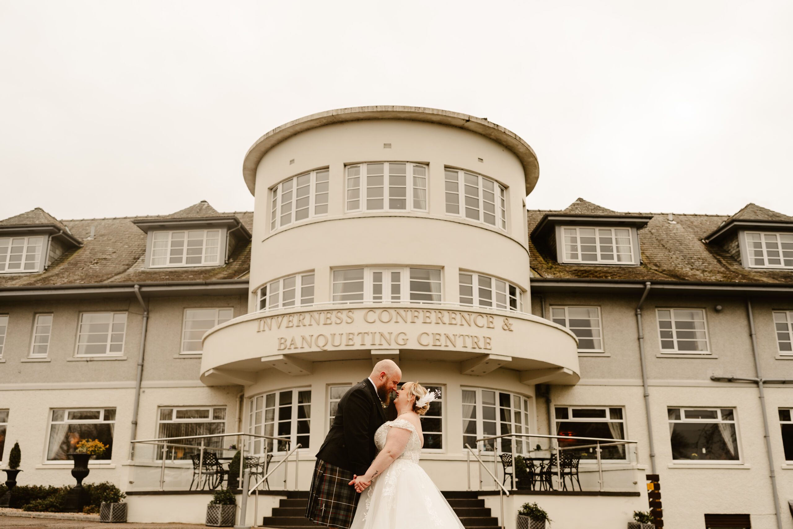 Bride and Groom kiss at Drumossie Hotel Wedding venue Inverness