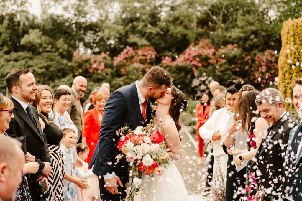bride and groom kiss during wedding at hazlehead park