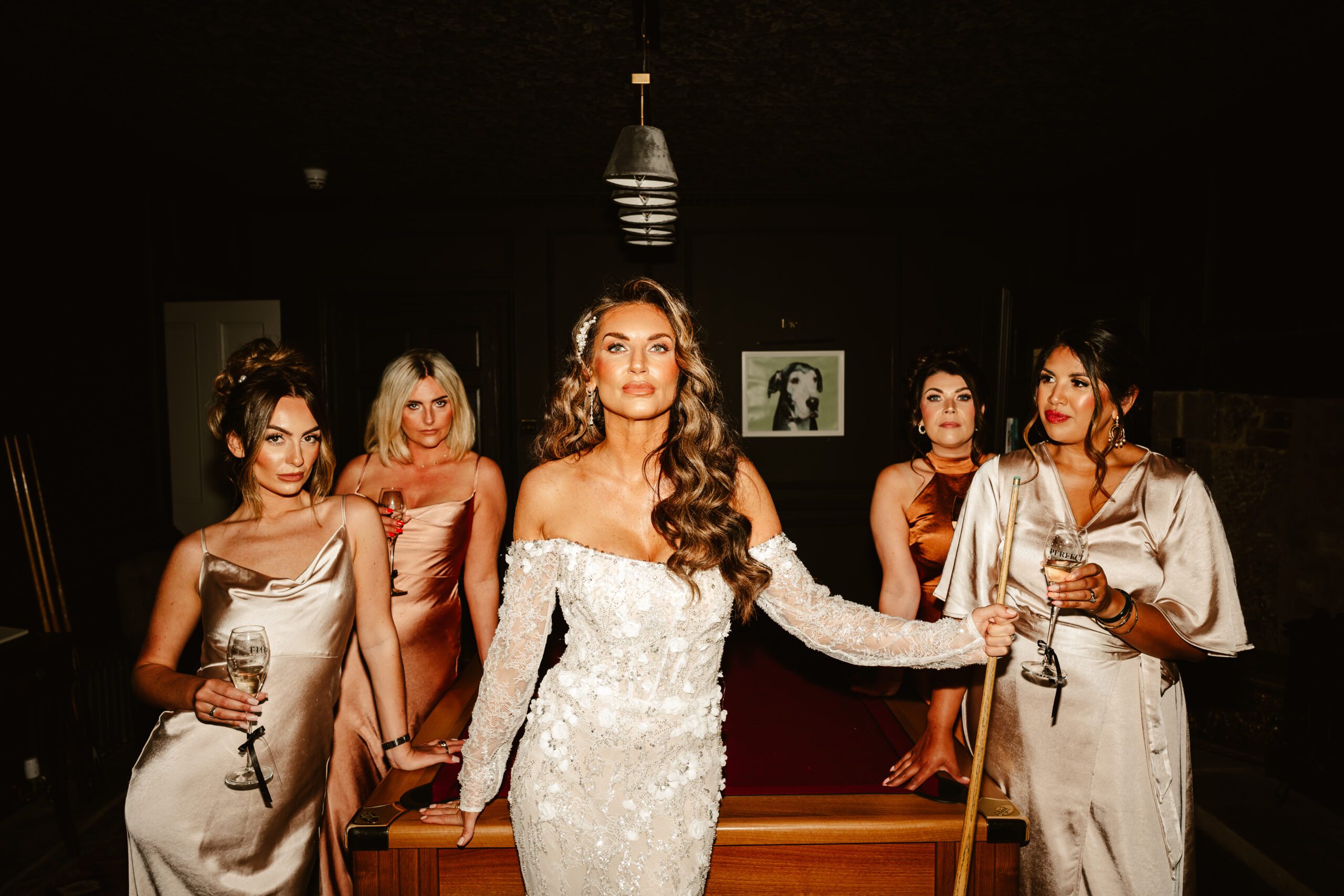 bride poses at pool table with bridesmaids at manar house inverurie