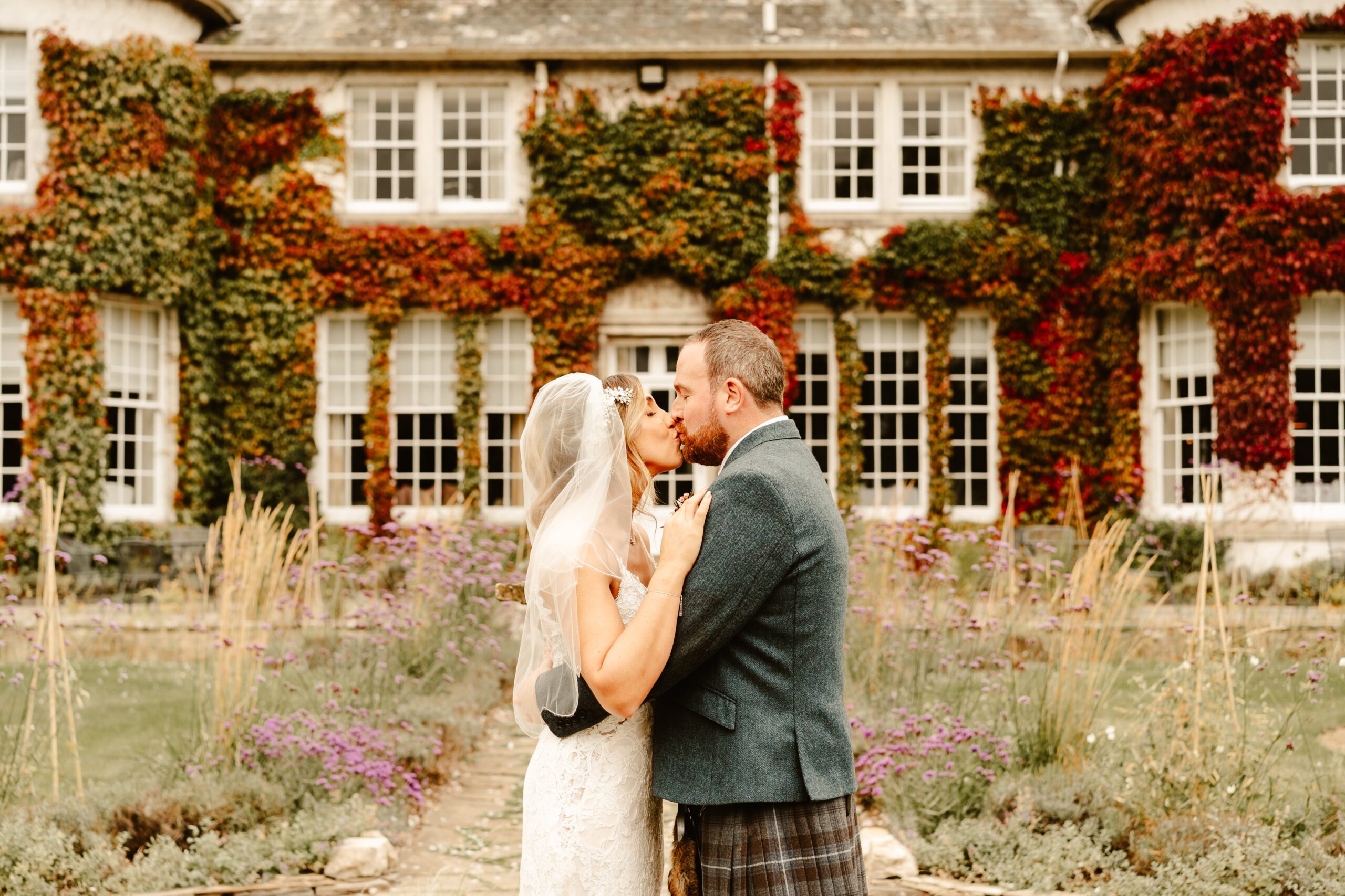 bride and groom kiss outside rufflets hotel photographed by danielle leslie photography